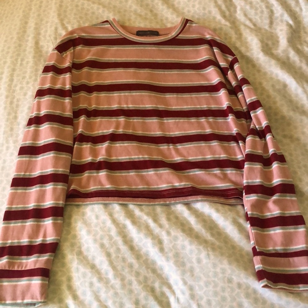A pink and red cropped long sleeve